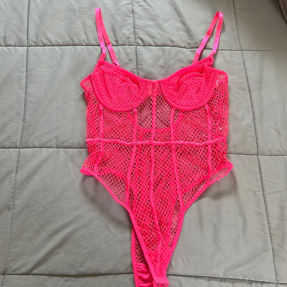Size M neon pink fishnet bodysuit